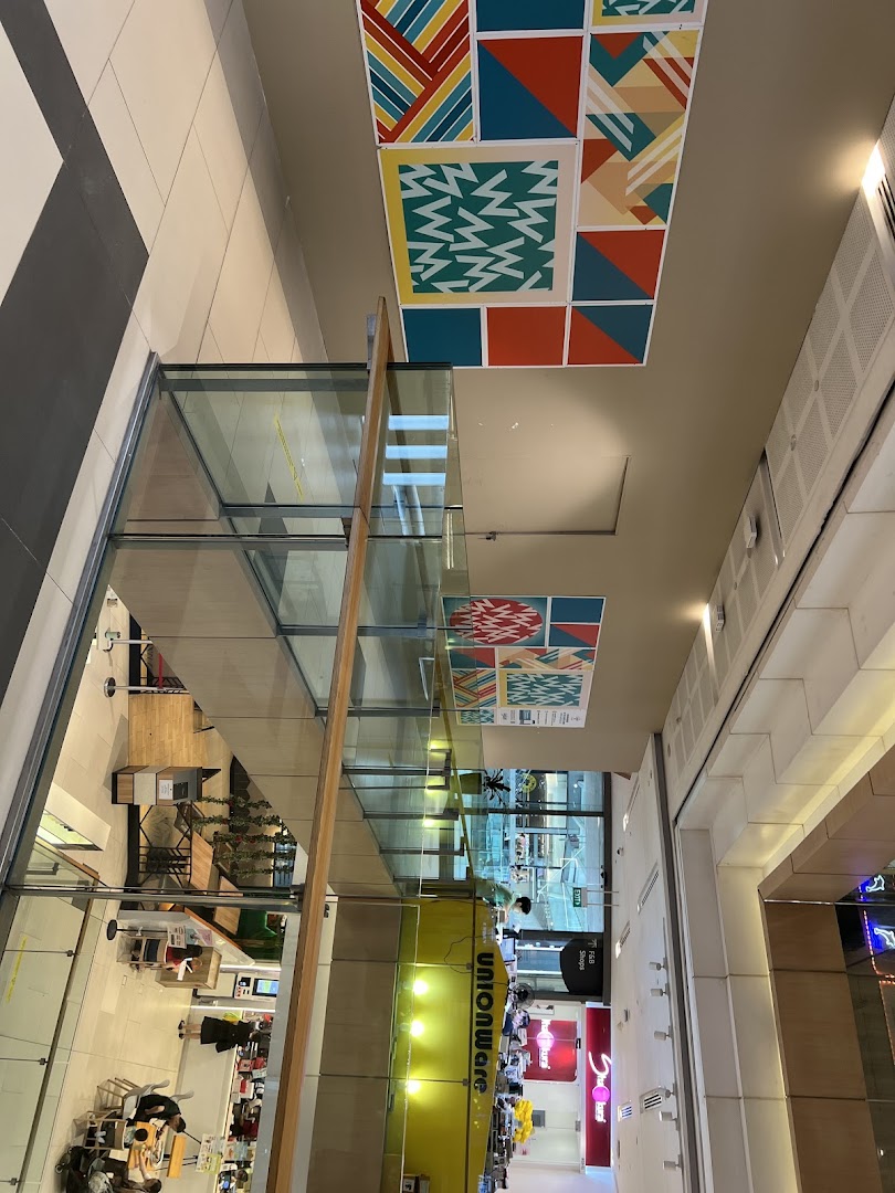 An overhead view of Westgate Mall's vibrant interior, showcasing various retail shops and modern design.