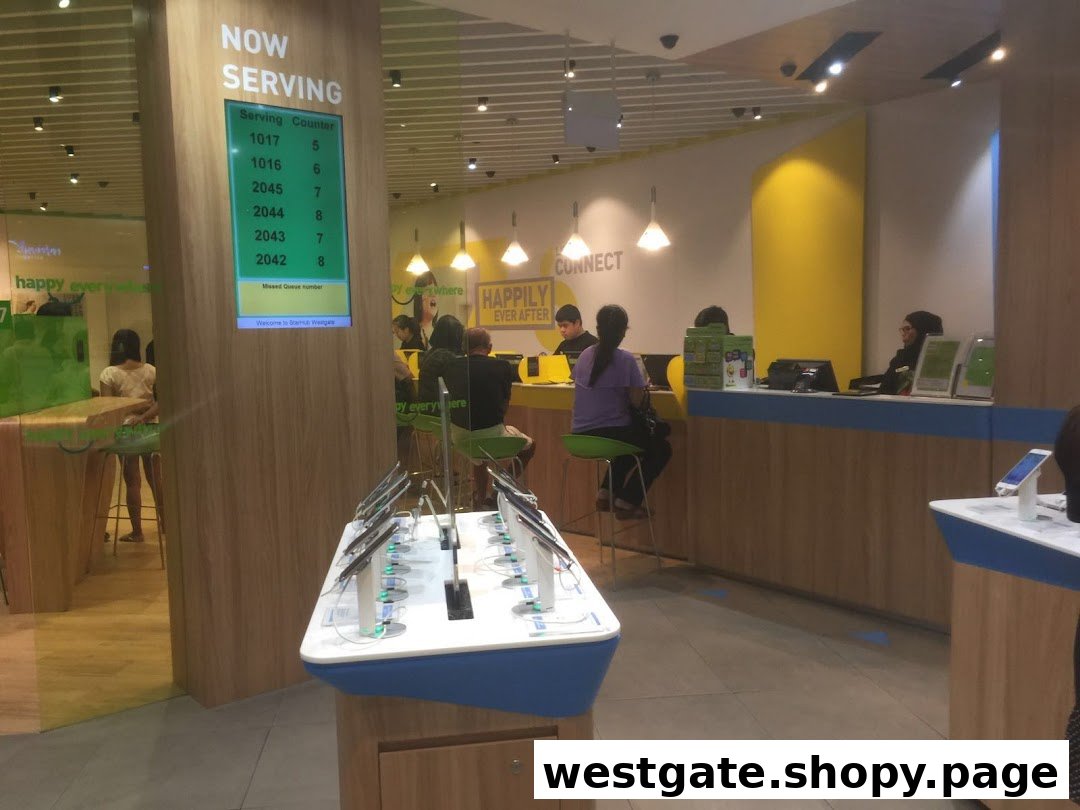 Interior view of StarHub Westgate, showing customer service counters, a queue display, and product showcases.