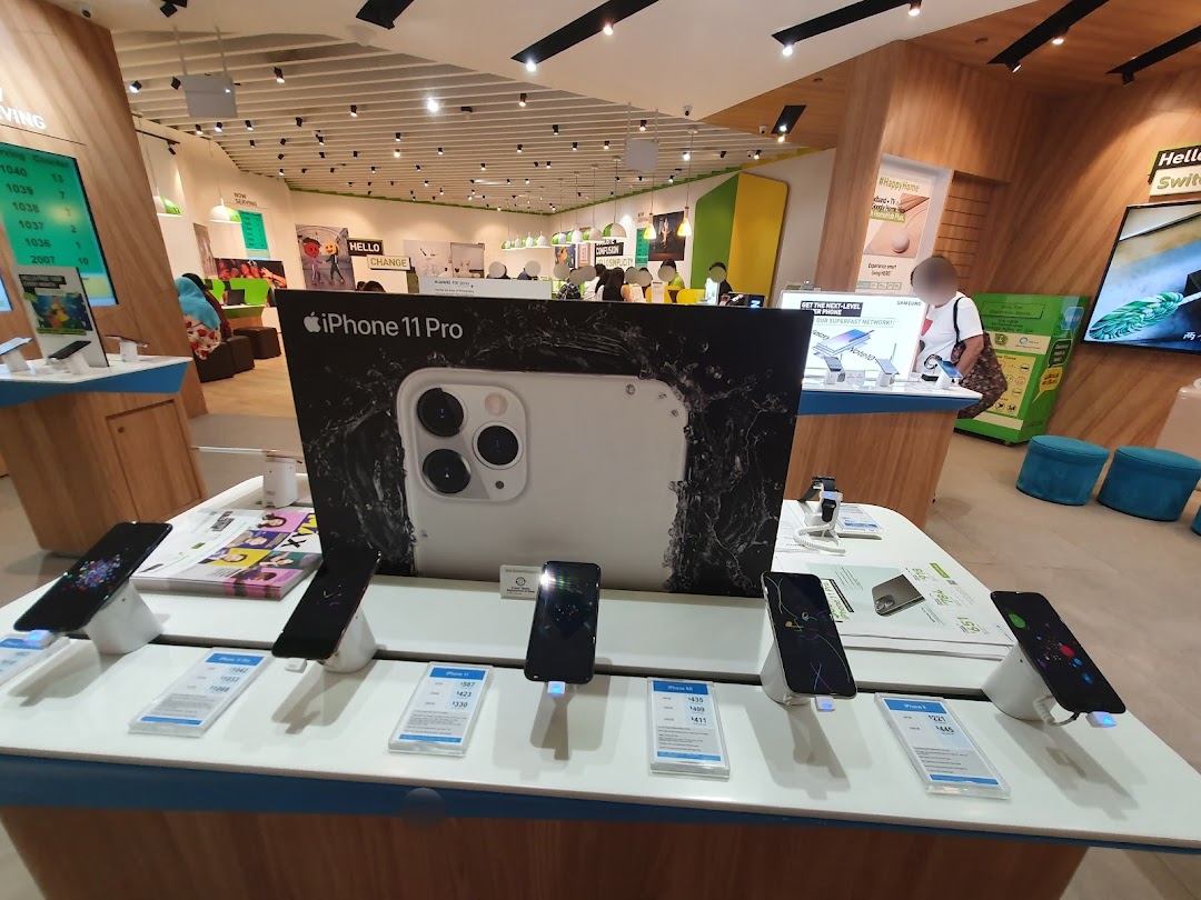 Interior view of StarHub Westgate, showcasing mobile phones like iPhone 11 Pro on display for customers.