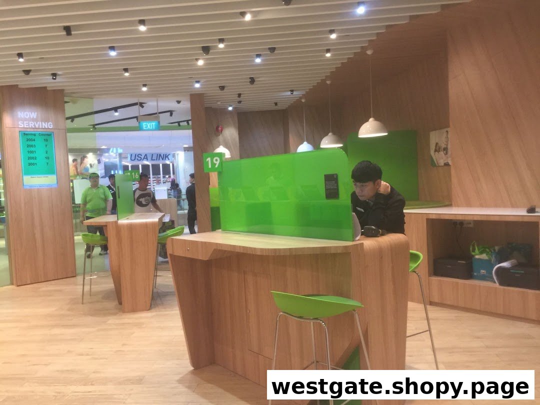 Interior of StarHub Westgate, featuring modern service counters and staff assisting customers.
