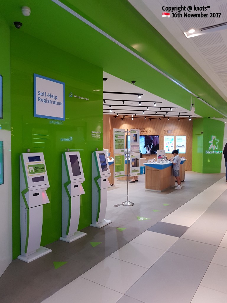 The StarHub Westgate store features self-help kiosks and a modern interior for customer service.
