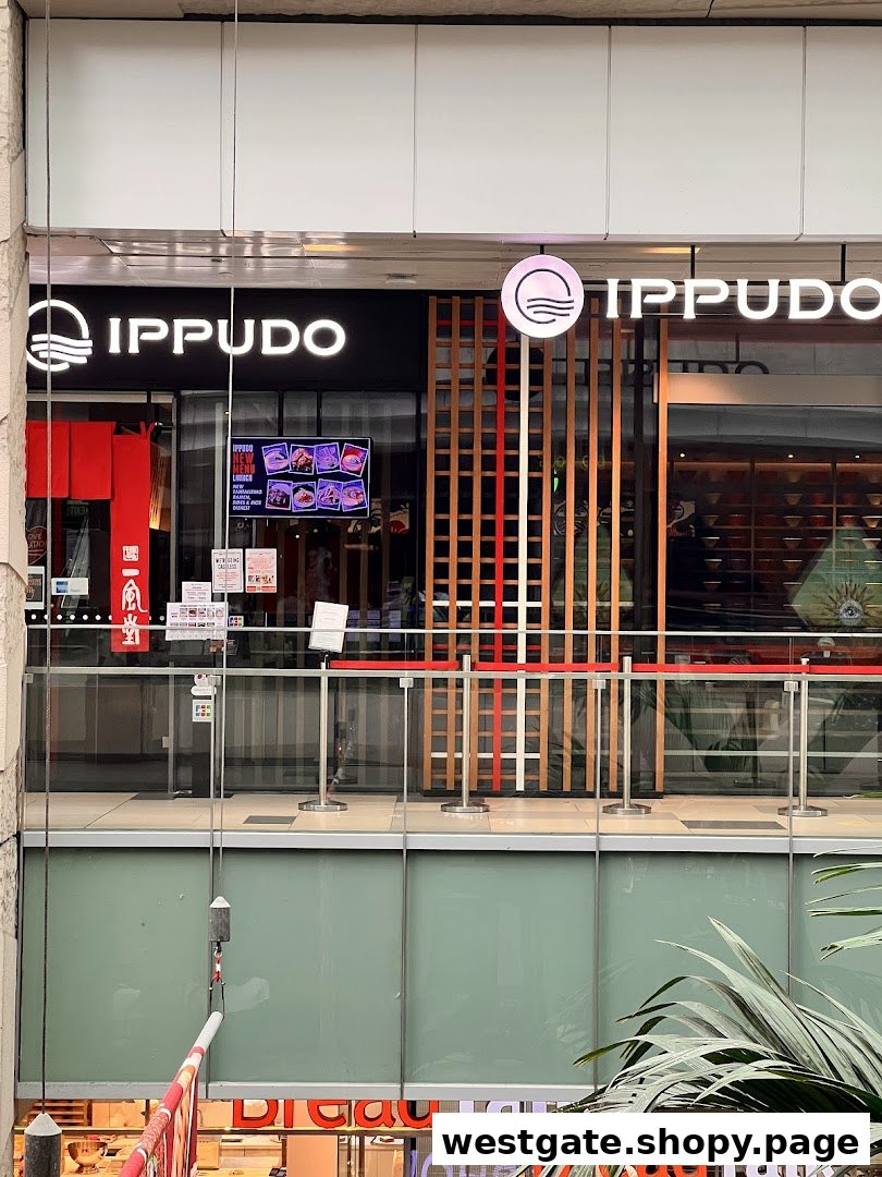 The shopfront of IPPUDO, a Japanese ramen restaurant, featuring its prominent logo and entrance.