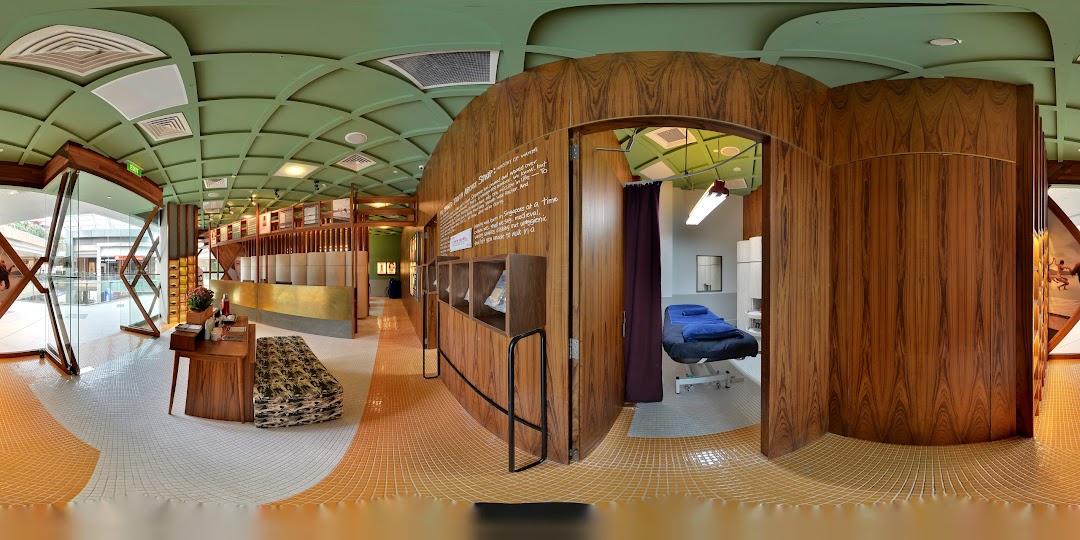Interior view of Strip Co-Ed Westgate, showcasing its modern reception, waiting area, and a treatment room.