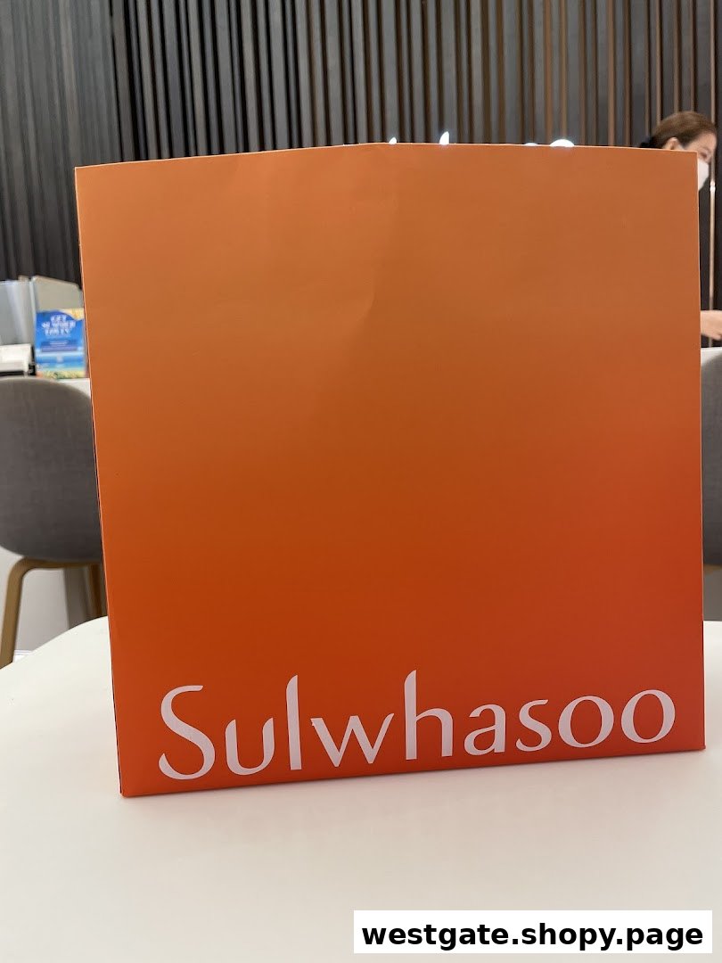 A Sulwhasoo branded item, likely a bag or display, on a white table inside the boutique.