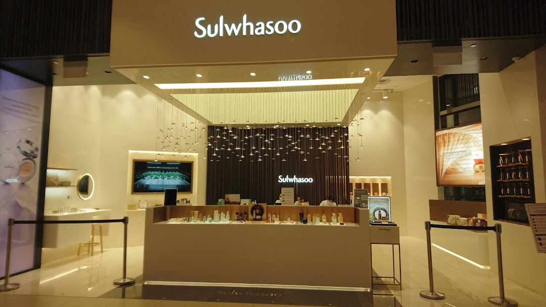 The elegant entrance of Sulwhasoo Boutique, showcasing skincare products and sophisticated interior design.