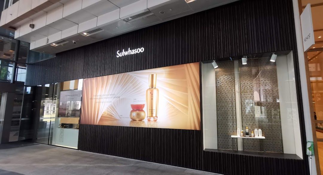 The exterior of Sulwhasoo Boutique features a large product display and elegant dark facade.