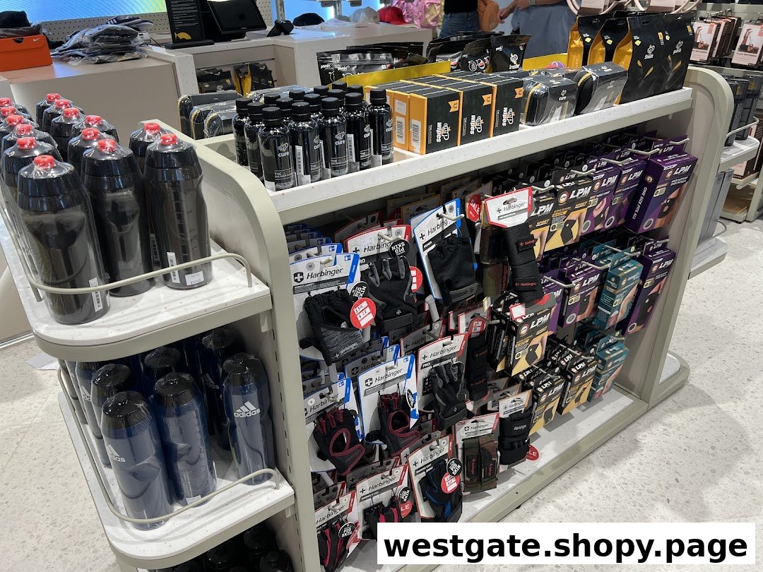 A retail display shelf showcasing various sports accessories, including water bottles, fitness gloves, and support gear.