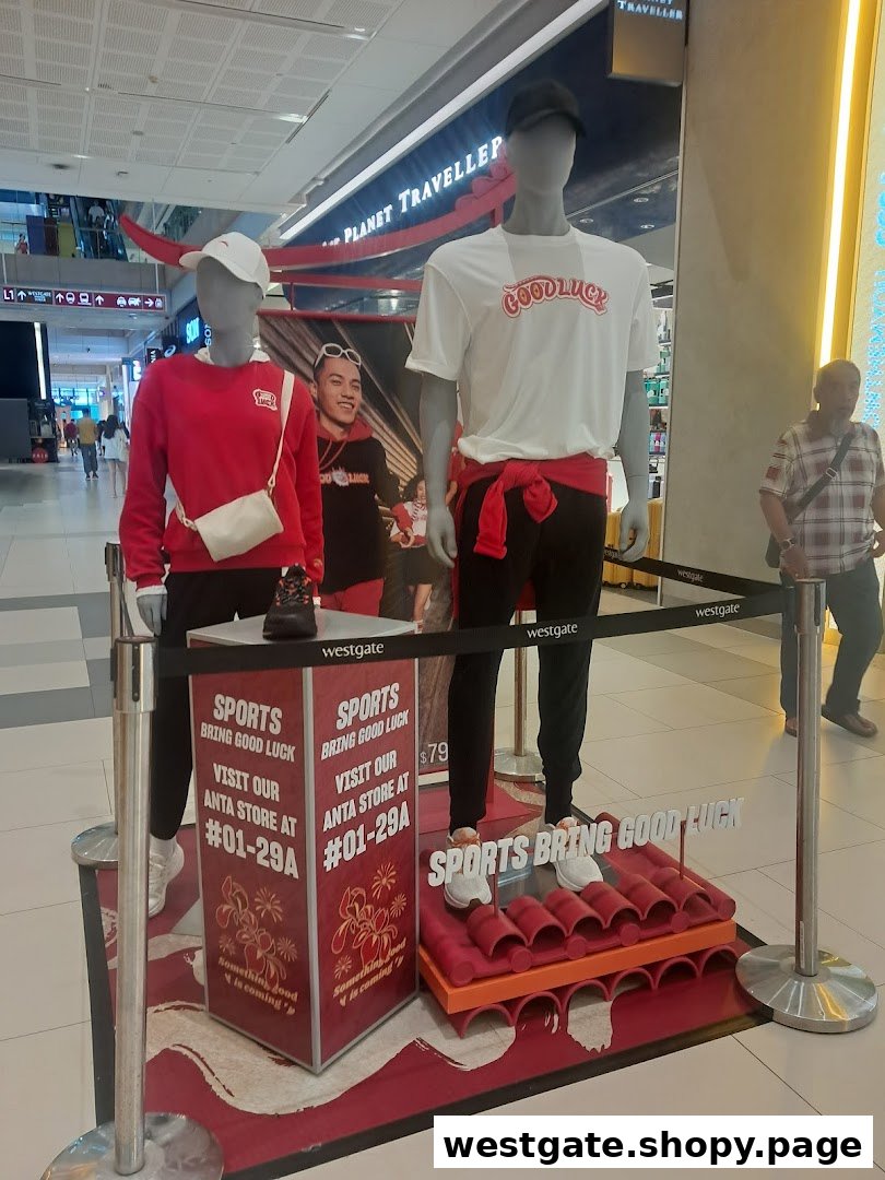 Sun Sand Sports showcases Anta sportswear with 'Sports Bring Good Luck' theme on mannequins.
