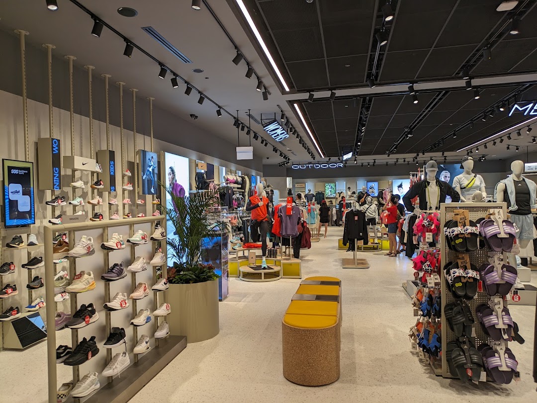 Interior view of Sun & Sand Sports, showcasing a wide range of athletic footwear, apparel, and accessories.
