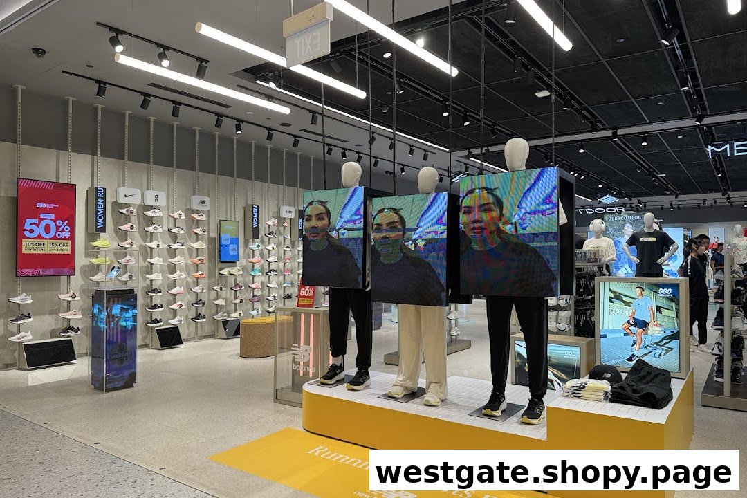 Interior view of Sun & Sand Sports, showcasing athletic footwear, apparel, and digital displays.
