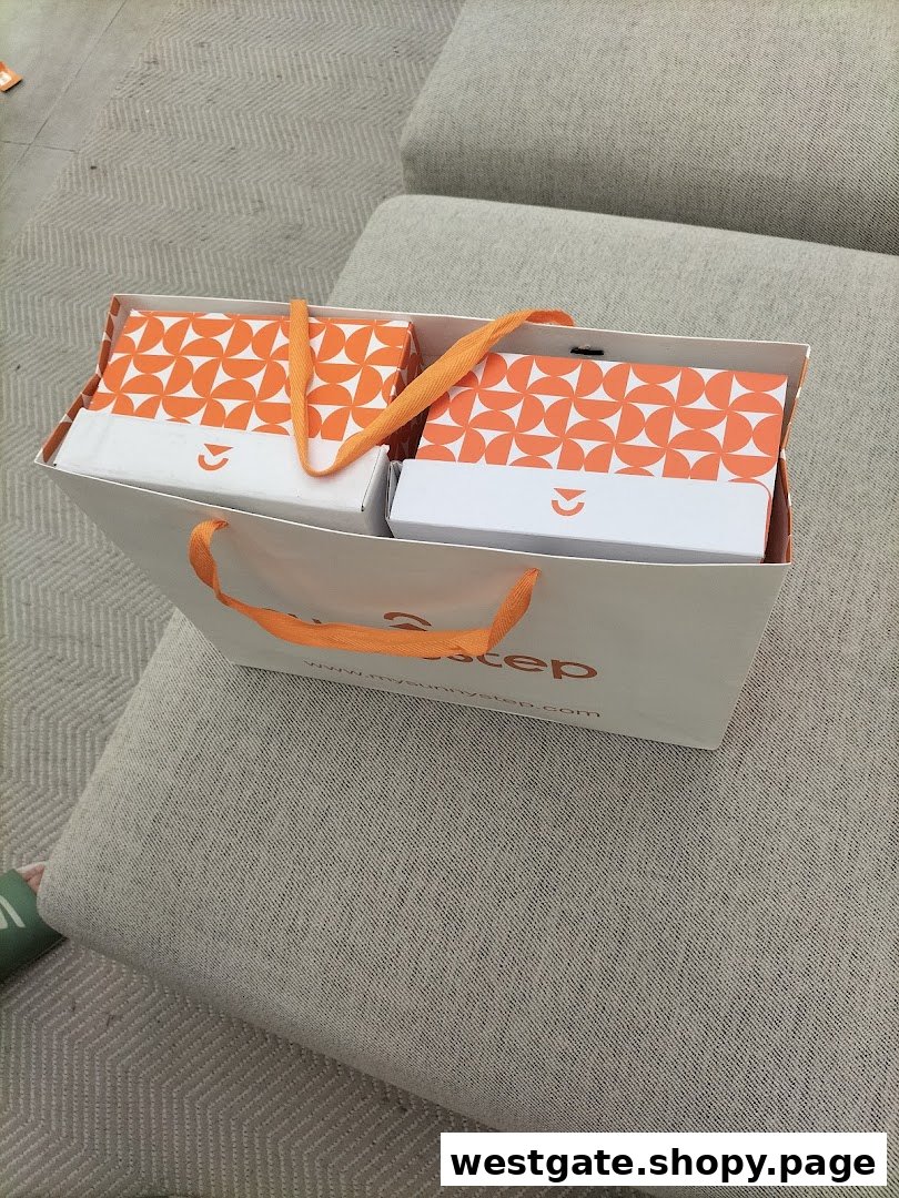 A white Sunnystep shopping bag containing two orange-patterned product boxes, resting on a sofa.
