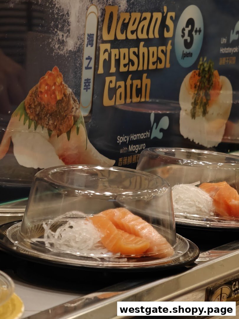 Fresh sushi plates, including salmon, on a conveyor belt with a promotional sign for 'Ocean's Freshest Catch'.