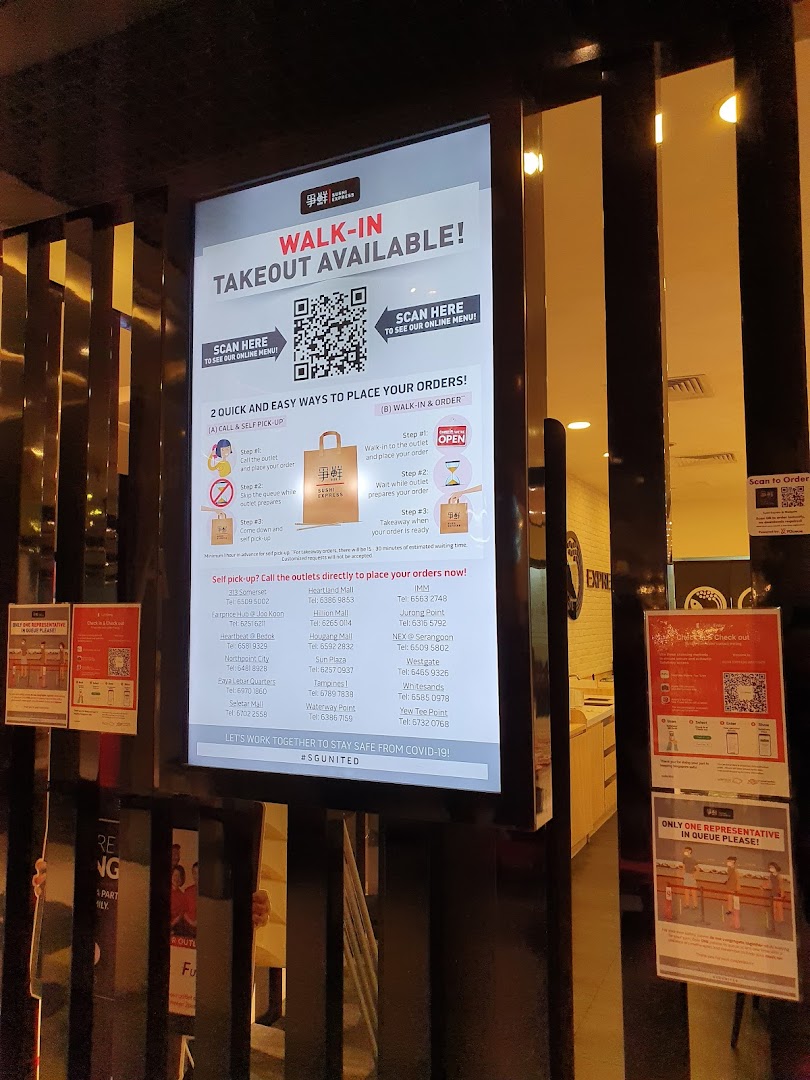 A digital display at Sushi Express detailing walk-in and takeout order procedures with outlet contact information.