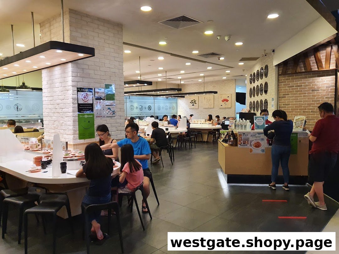 Interior of Sushi Express, showing customers enjoying conveyor belt sushi and a lively dining atmosphere.