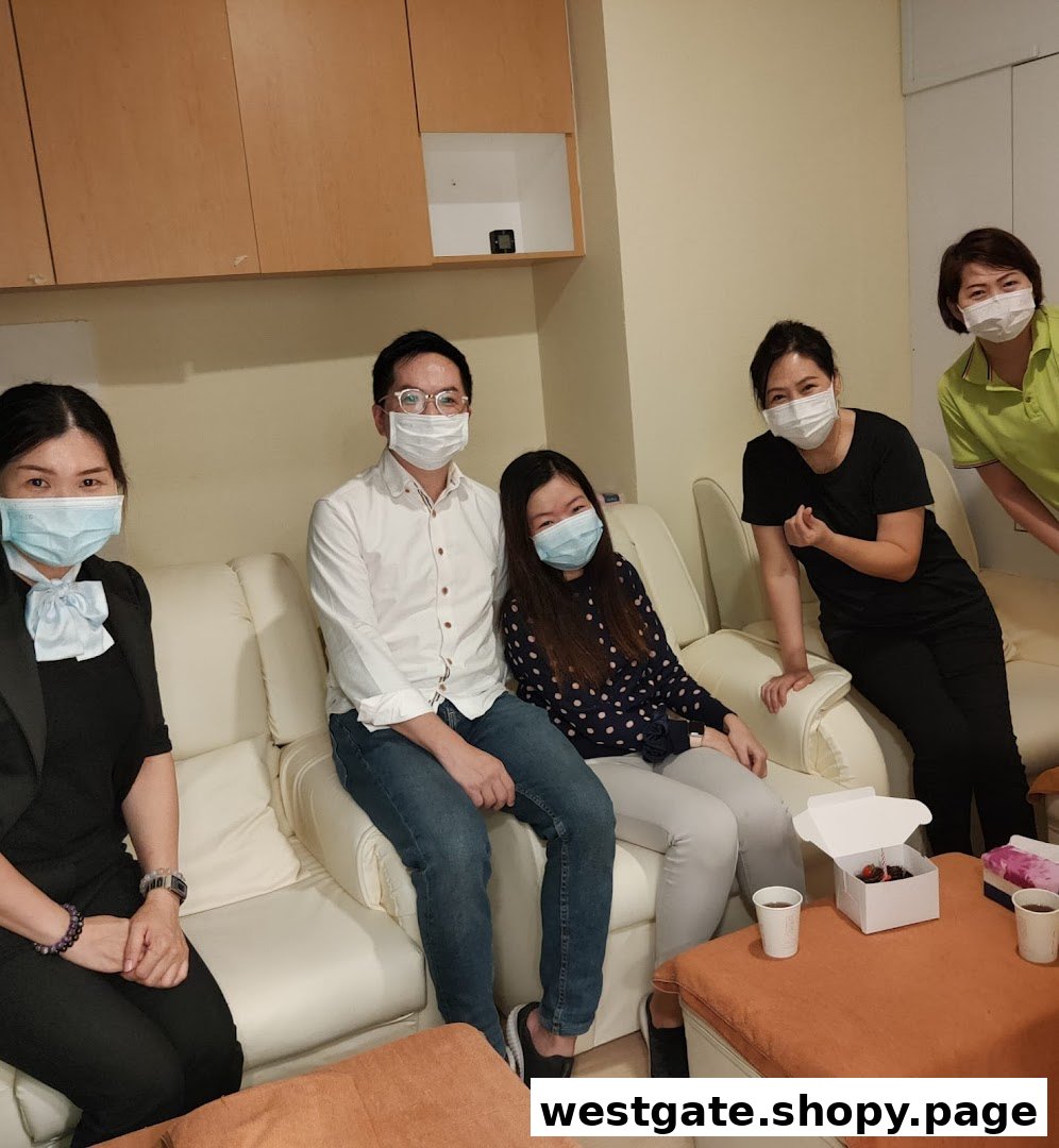 Customers and staff wearing masks, relaxing on sofas in a comfortable setting.
