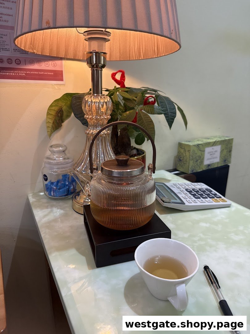 A cozy corner with a teapot, cup of tea, and lamp, suggesting a relaxing atmosphere.