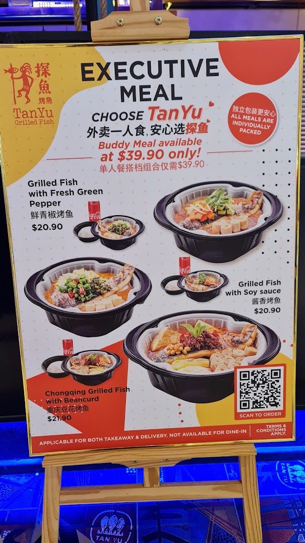 A menu board for TANYU Grilled Fish, showcasing executive and buddy meal options for takeaway and delivery.