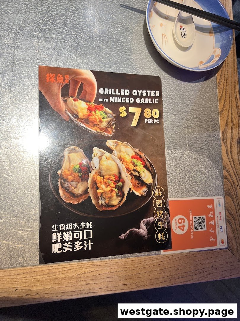A menu page from TANYU featuring grilled oysters with minced garlic, their price, and a QR code for ordering.