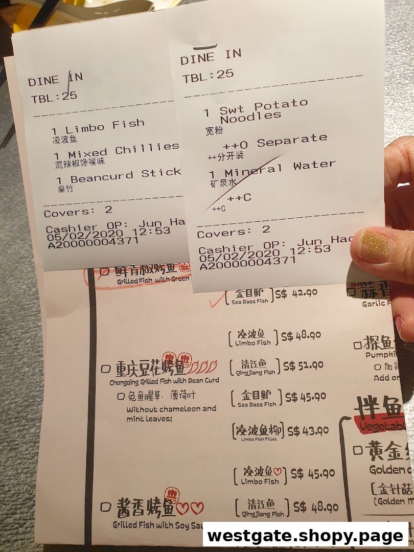 A close-up view of TANYU's menu and customer receipts, showcasing popular grilled fish options and add-ons.