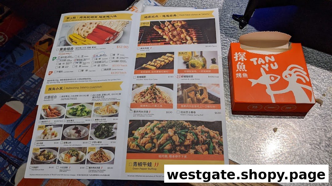 A detailed menu from TANYU Westgate showcasing various dishes and a branded takeaway box.