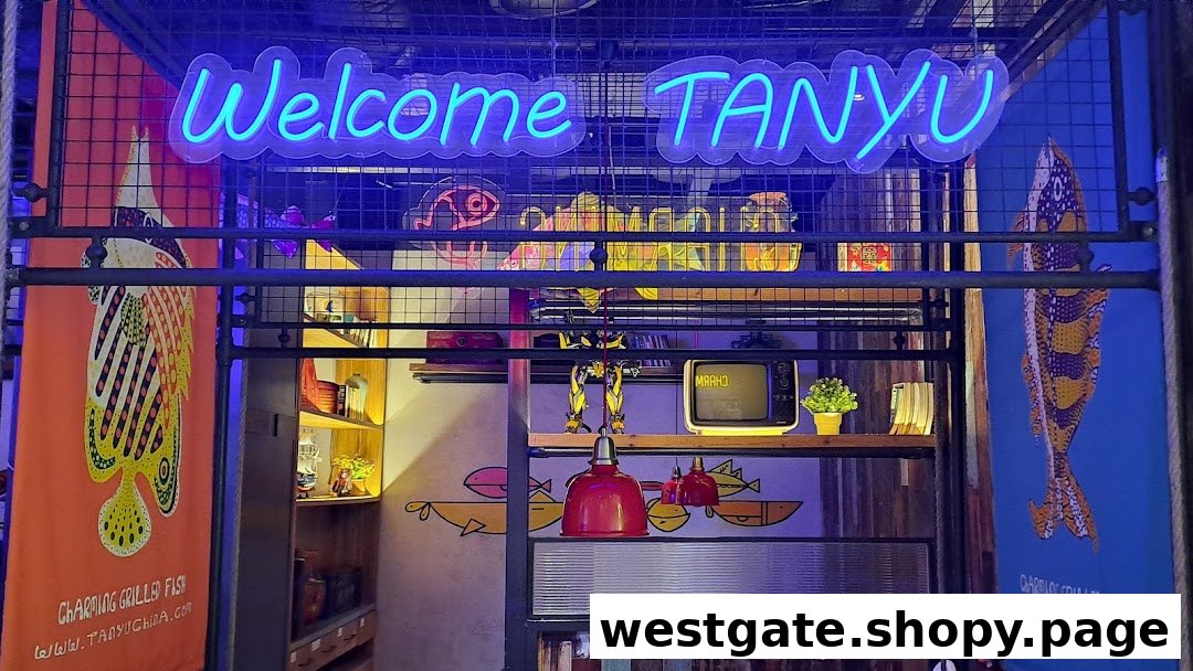 A vibrant neon 'Welcome TANYU' sign illuminates the entrance of the grilled fish restaurant.