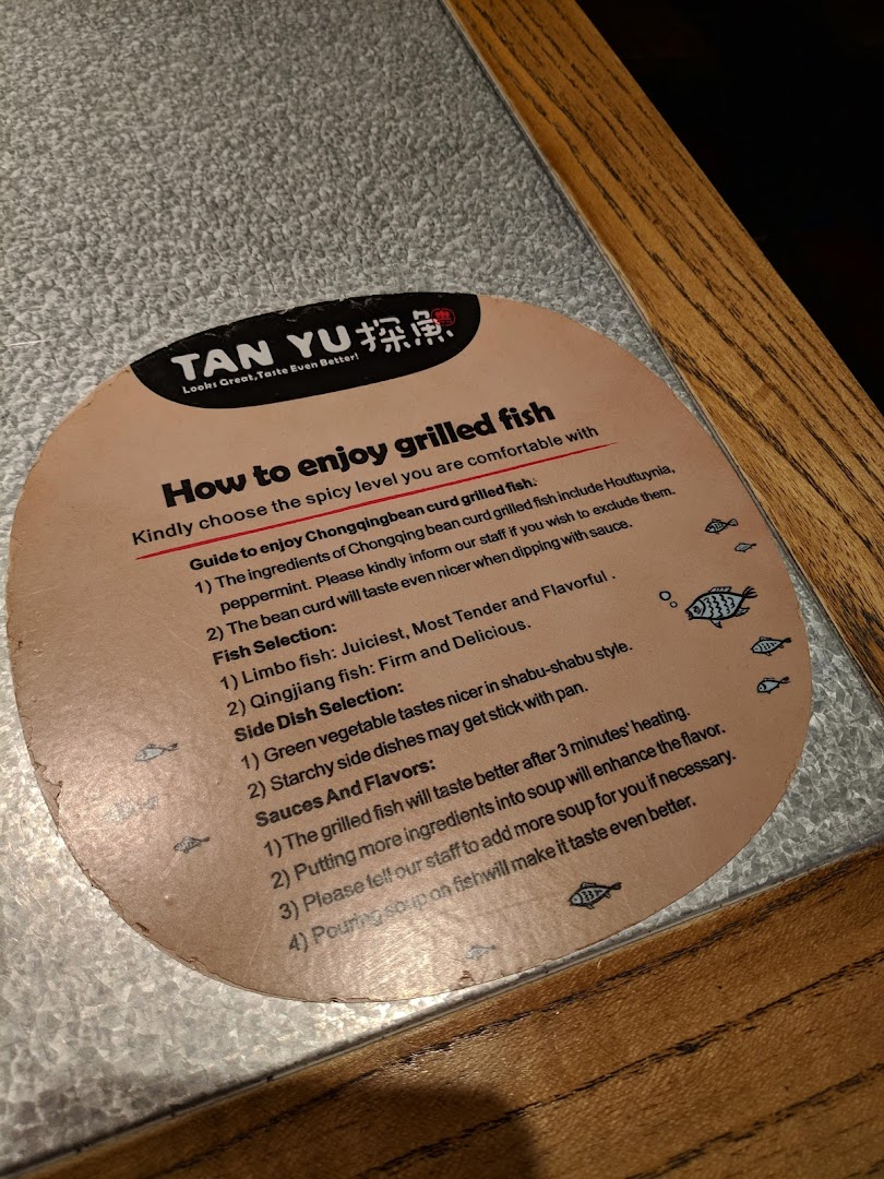 A circular dining guide from TANYU detailing how to enjoy their signature grilled fish.