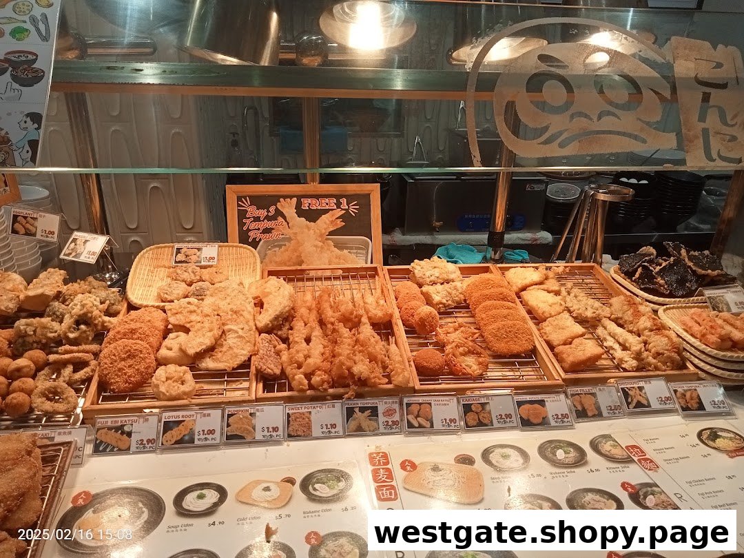 A vibrant display counter showcasing a wide variety of freshly fried tempura and Japanese delights.
