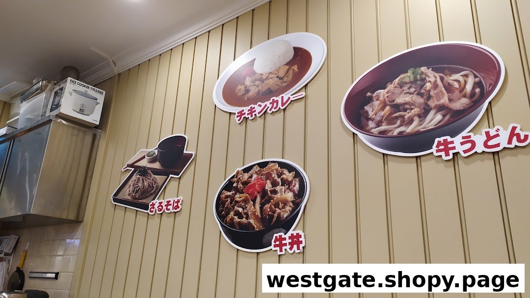 Wall-mounted displays showcasing various Japanese dishes like curry, udon, soba, and gyudon.