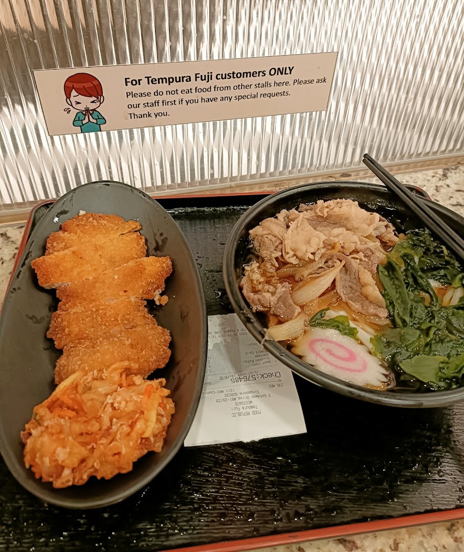 A delicious spread featuring crispy katsu, a vegetable fritter, and a comforting beef noodle soup from Tempura Fuji.