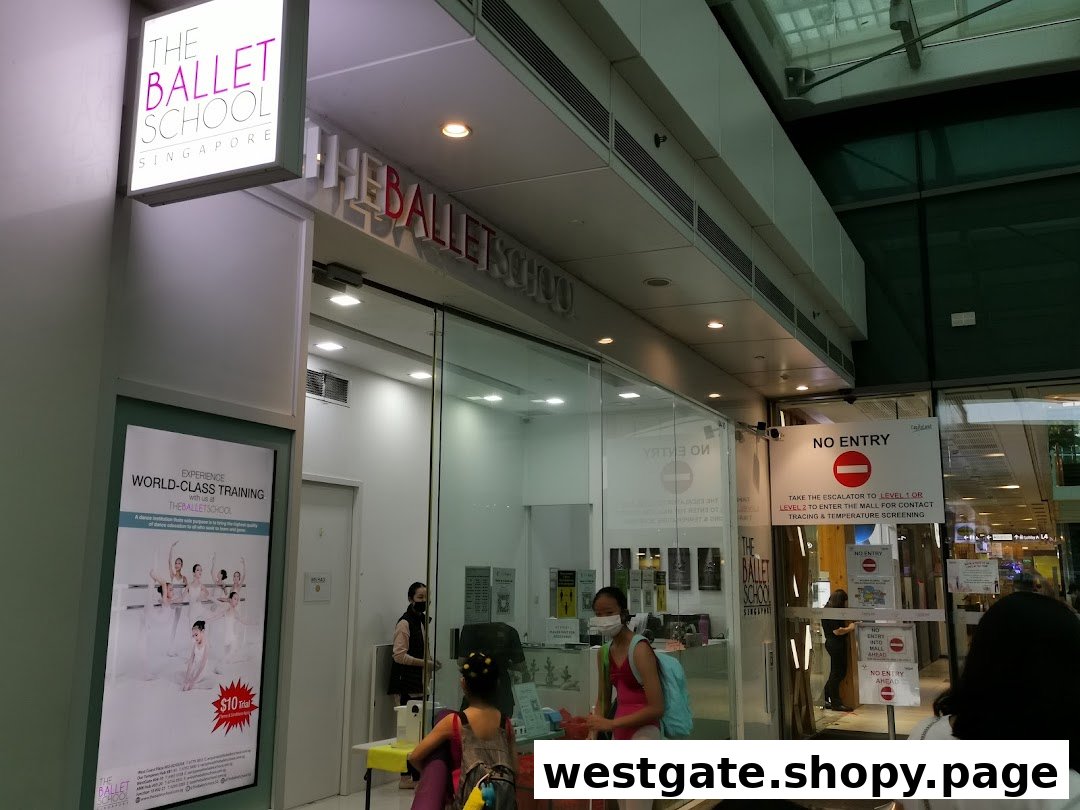 The entrance of The Ballet School Singapore, featuring its prominent signage and glass storefront.