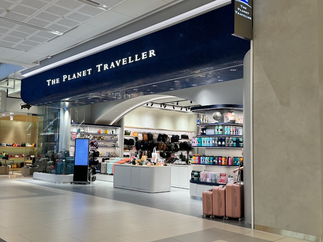 The Planet Traveller shopfront showcasing travel essentials, luggage, and accessories in a modern retail space.