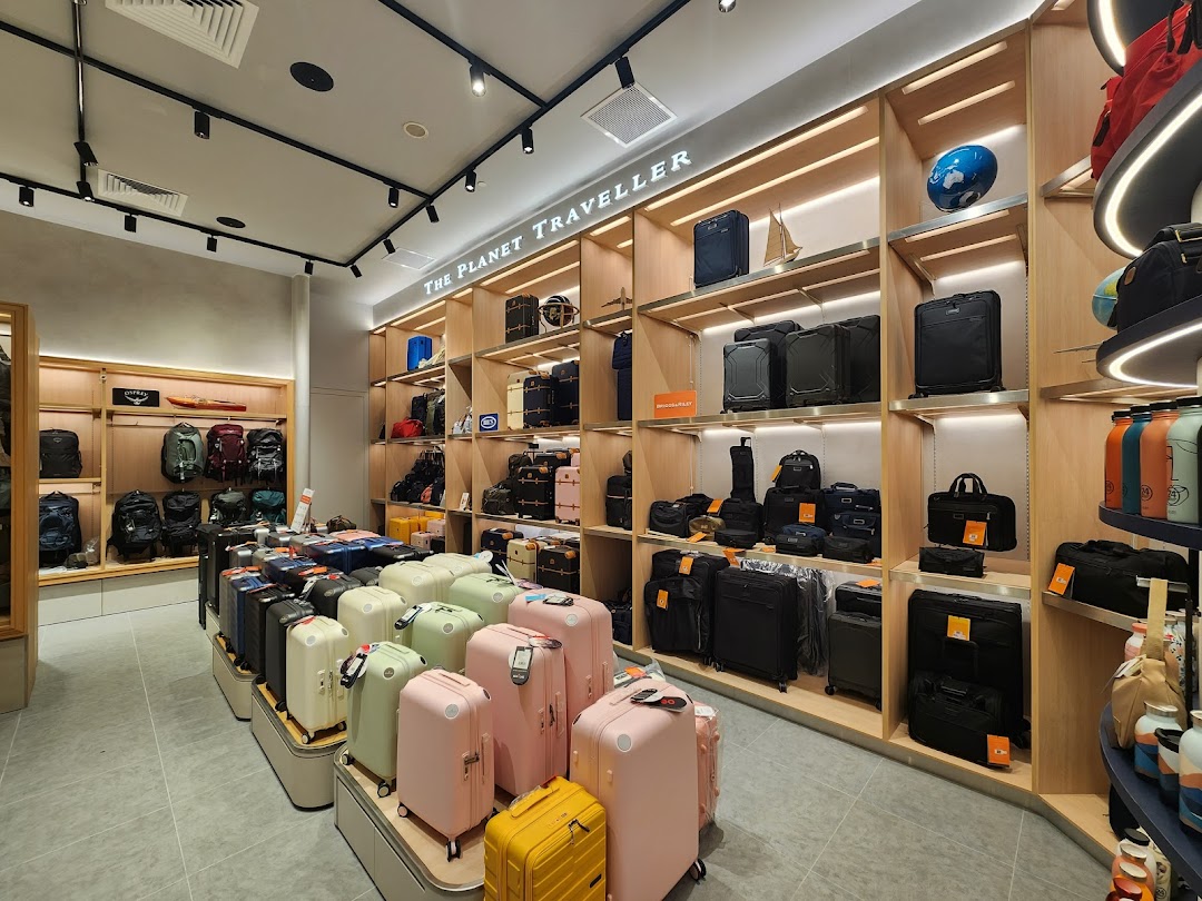 Interior view of The Planet Traveller showcasing a wide array of luggage, travel bags, and accessories.