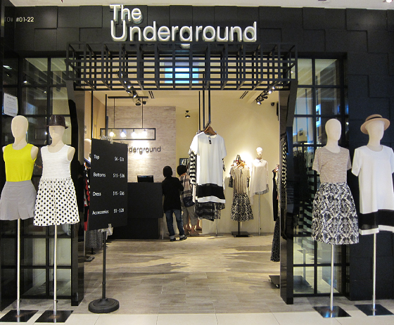 The storefront of 'The Underground' fashion boutique, featuring mannequins displaying trendy apparel and a view into the interior.