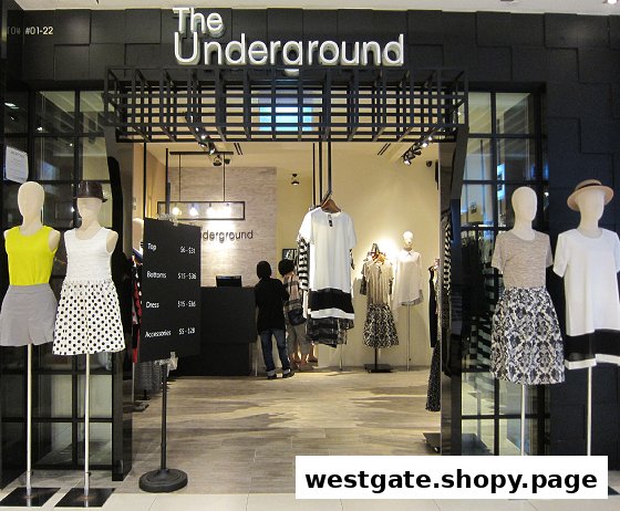 The storefront of 'The Underground' fashion boutique, featuring mannequins displaying trendy apparel and a view into the interior.