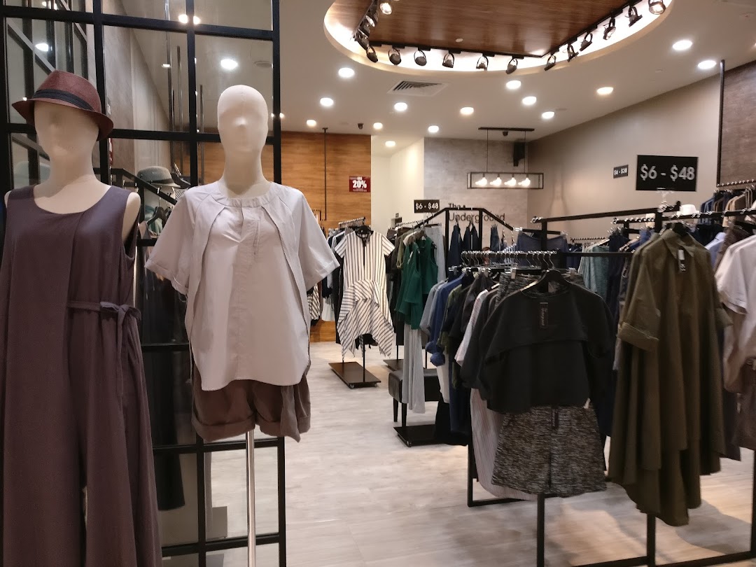 Interior of The Underground clothing store, showcasing mannequins and diverse apparel on display.