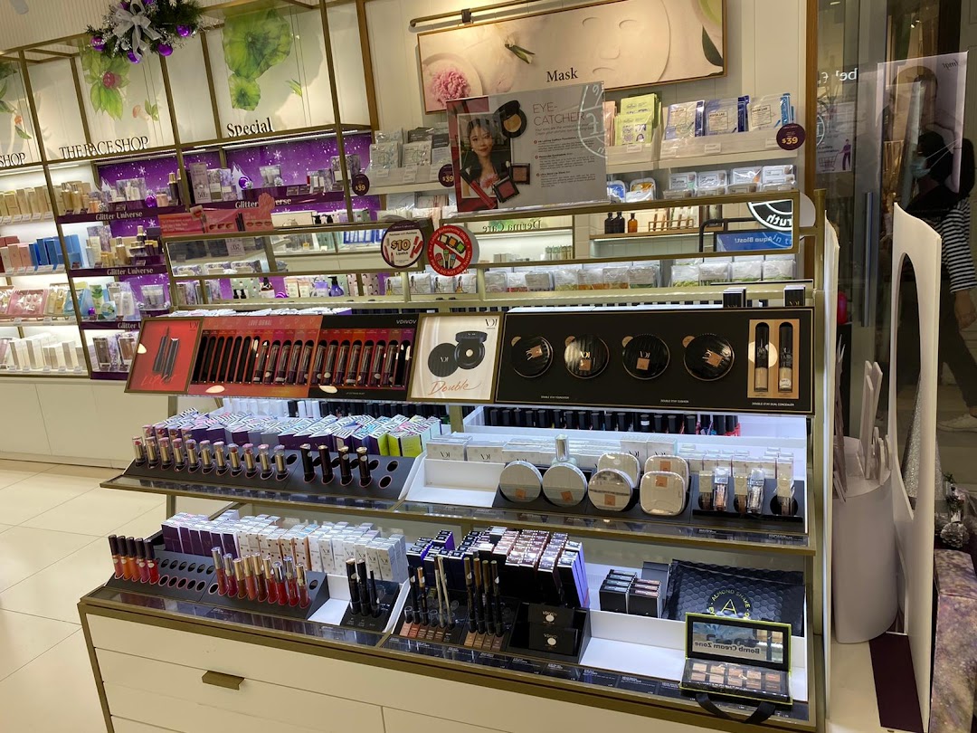 An interior view of THEFACESHOP, showcasing a wide array of skincare and cosmetic products on display shelves.
