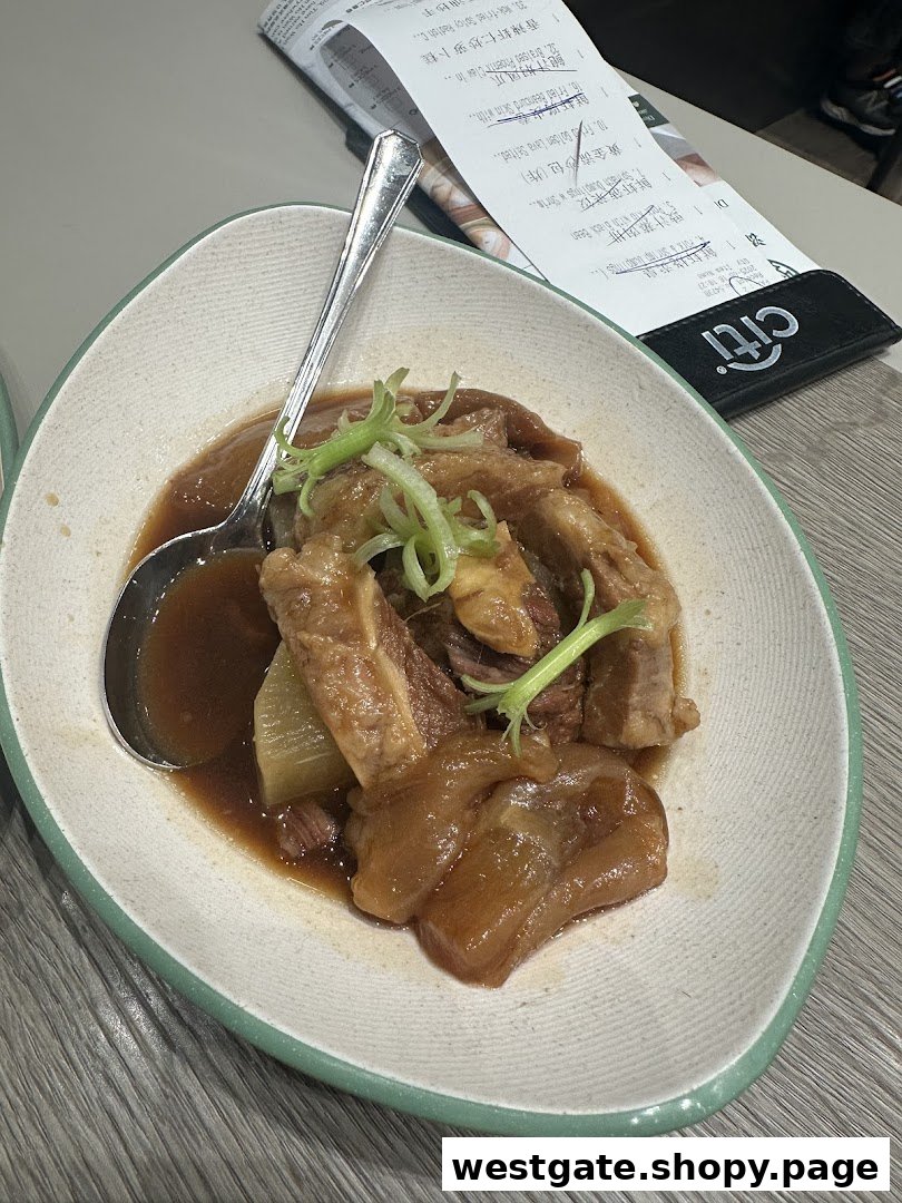 A delicious plate of braised meat and radish, garnished with fresh green onions, served at Tim Ho Wan.