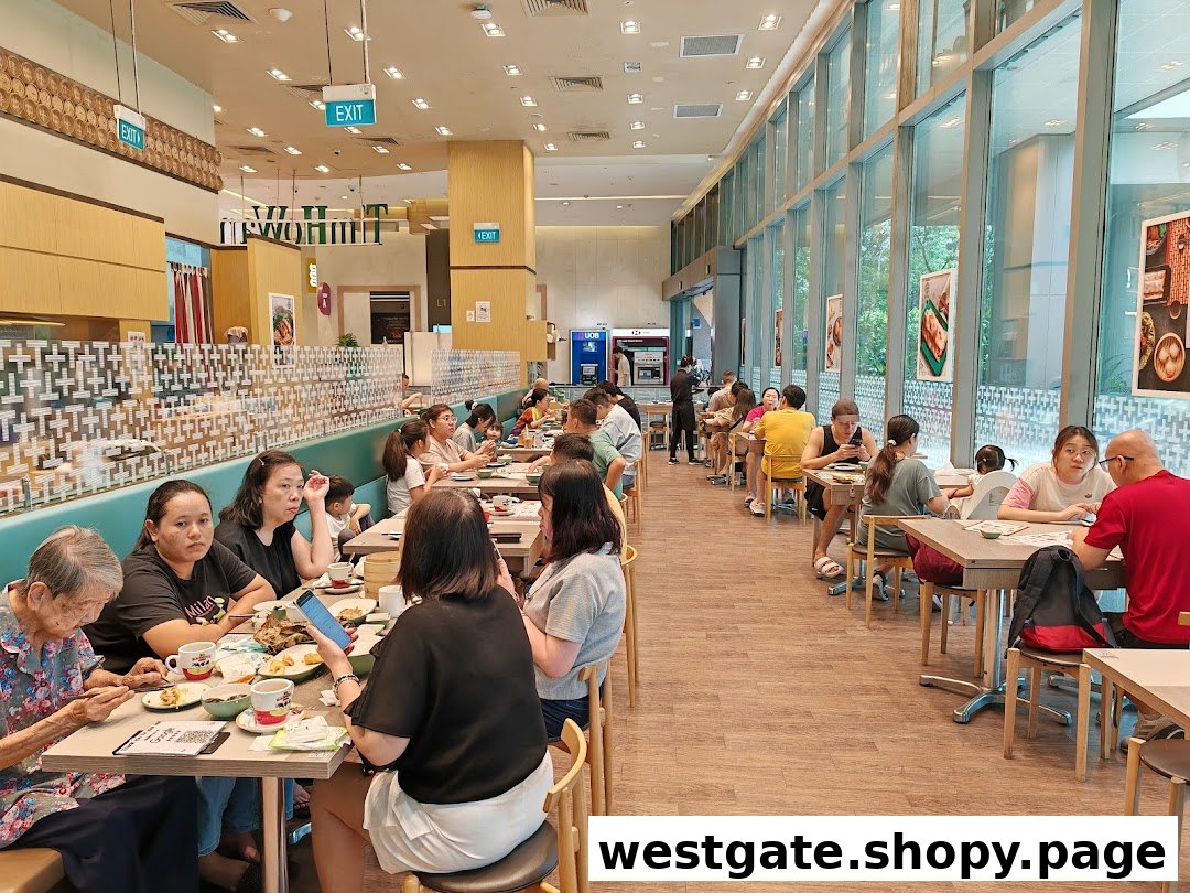 A bustling Tim Ho Wan restaurant interior with customers enjoying dim sum at various tables.