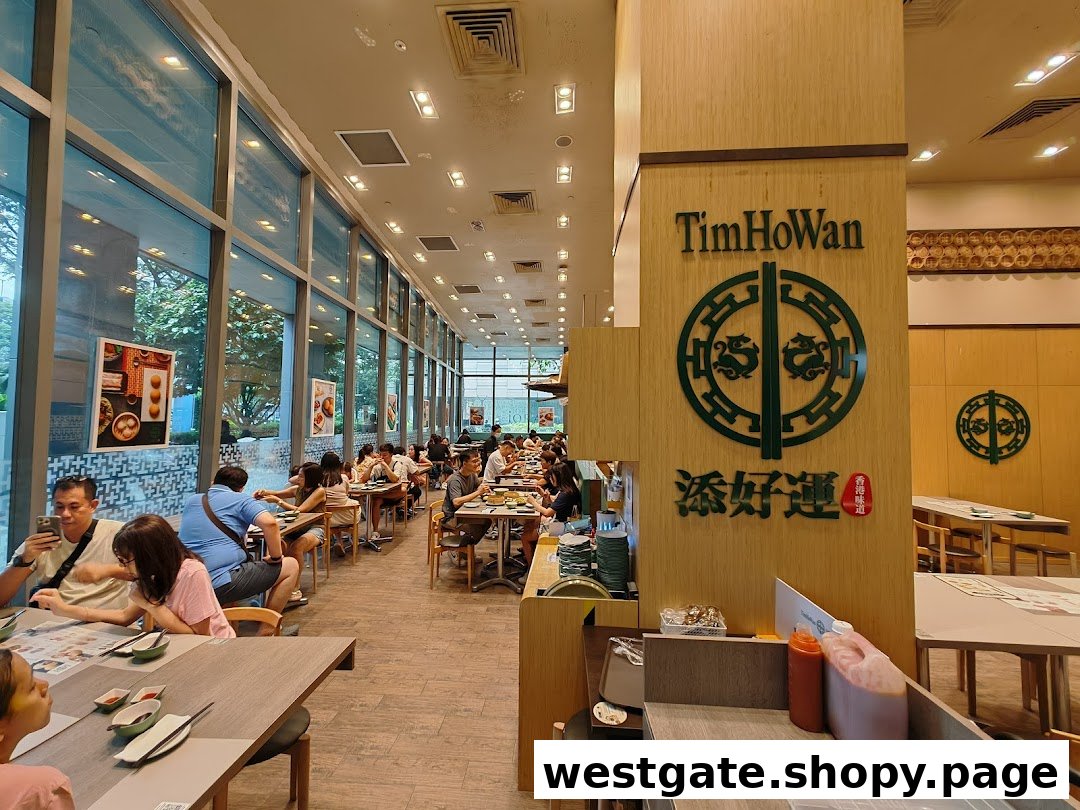 Diners enjoy authentic dim sum in the spacious, brightly lit interior of Tim Ho Wan restaurant.
