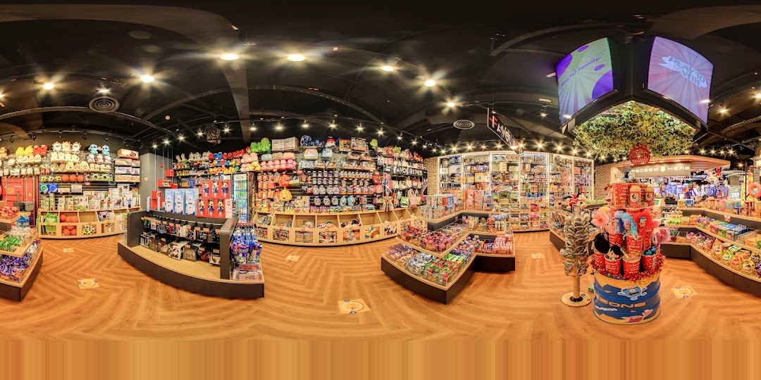 A vibrant interior view of Timezone's prize shop, showcasing a wide array of toys, plushies, and merchandise.
