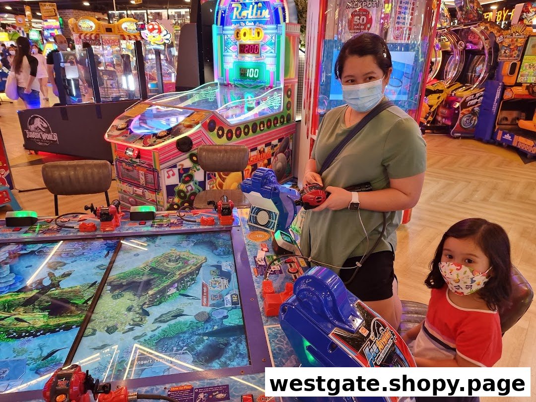 An adult and child play an interactive fishing arcade game at Timezone, surrounded by other colorful machines.