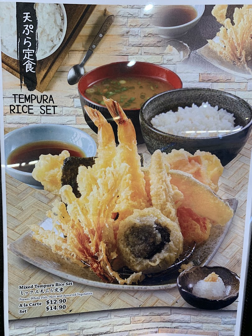 A vibrant image showcasing a Mixed Tempura Rice Set with prawns, fish, nori, and vegetables.