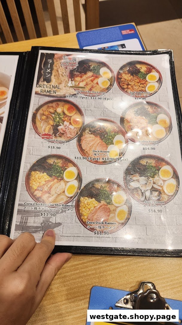 A close-up view of a ramen menu displaying various noodle dishes with prices and images.