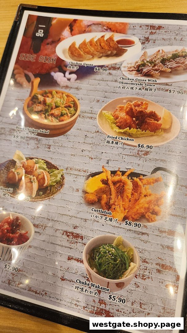 A close-up of a Japanese restaurant menu displaying various side dishes with photos and prices.