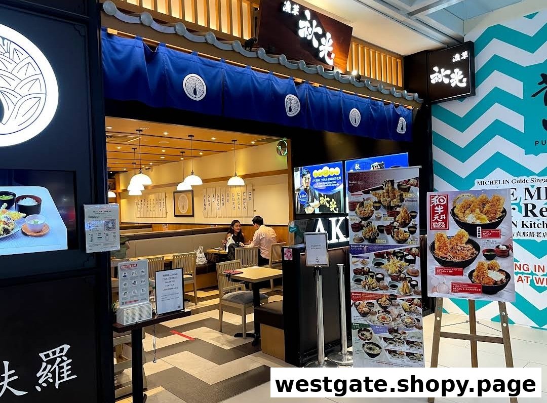 The inviting entrance of Tokyo Shokudo Westgate, a Japanese restaurant, with customers dining inside and promotional displays outside.