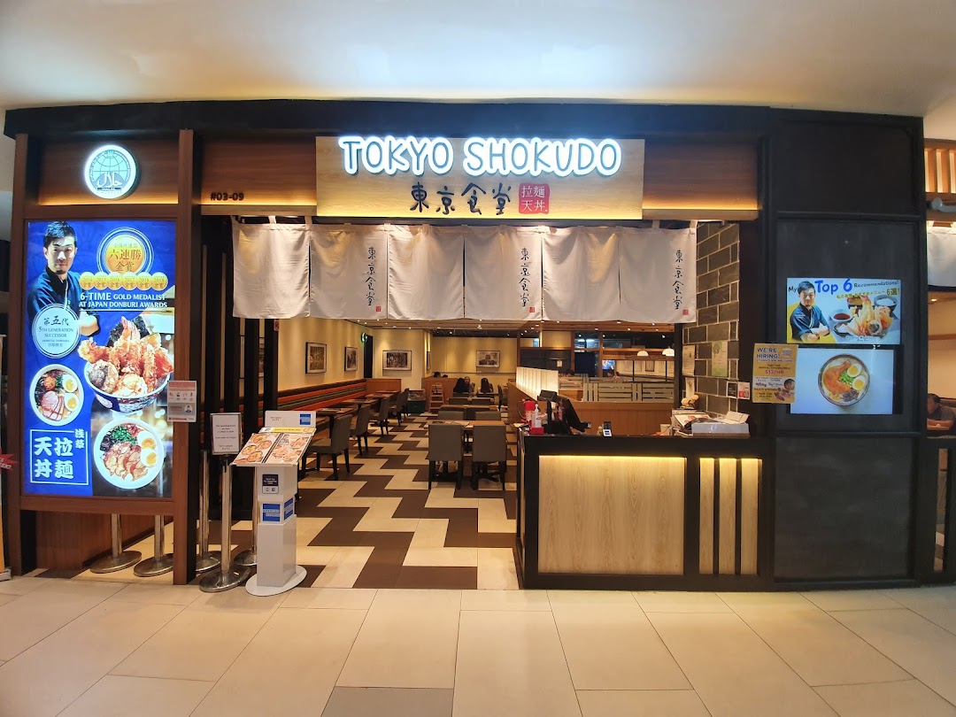 The brightly lit entrance of Tokyo Shokudo, a Japanese restaurant, showcasing its inviting interior and award-winning dishes.