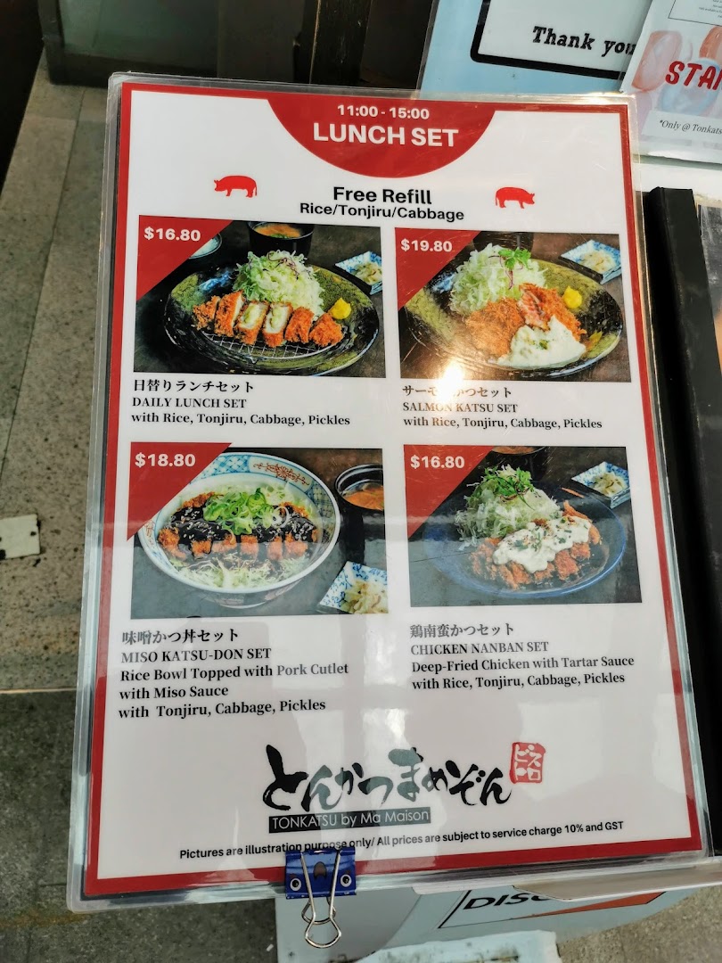 A menu board displaying lunch sets with prices and descriptions from Tonkatsu by Ma Maison.