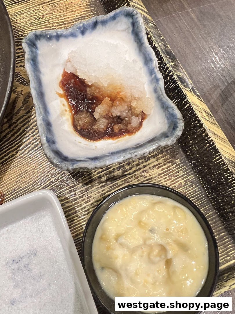 Close-up of various Japanese condiments and sauces on a wooden tray.