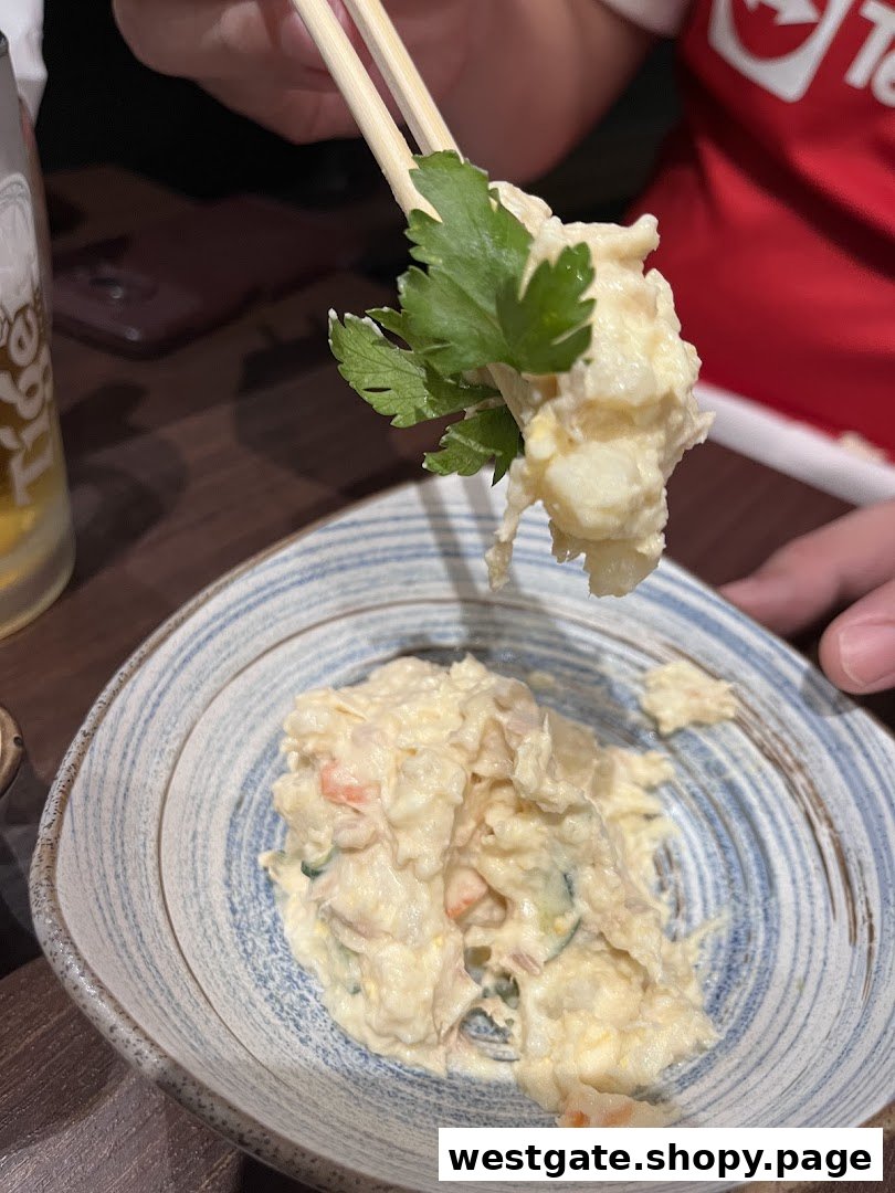 A close-up of creamy potato salad with parsley being served with chopsticks.