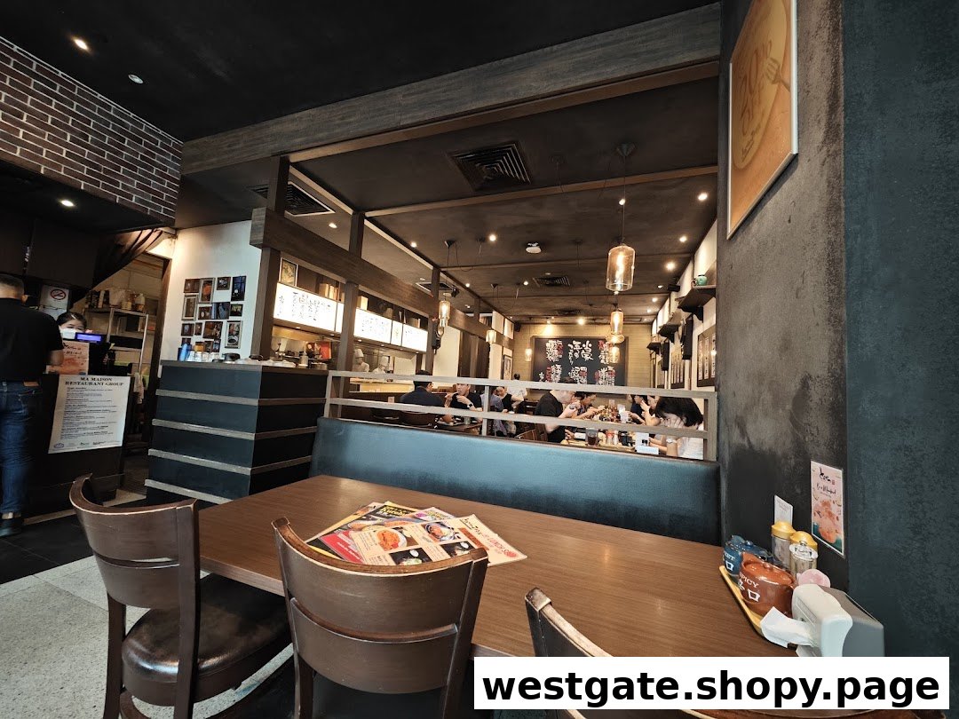 An inviting interior view of Tonkatsu by Ma Maison, featuring dining tables and a cozy ambiance.